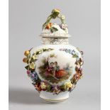 A VIENNA STYLE PORCELAIN LIDDED VASE, applied with floral decoration. 9.75ins high.