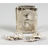 A SILVER GOLFING PILL BOX EMBOSSED WITH A GOLFER, with a pair of golf ball silver cufflinks.