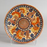 CHARLOTTE RHEAD FOR CROWN DUCAL, a slip decorated circular charger, Pattern No. 2481, painted with