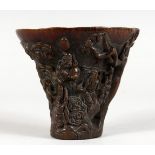 A CHINESE CARVED HORN LIBATION CUP. 5ins high.