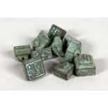 A SET OF TEN CHINESE BRONZE MINIATURE SEALS. 0.5ins wide.