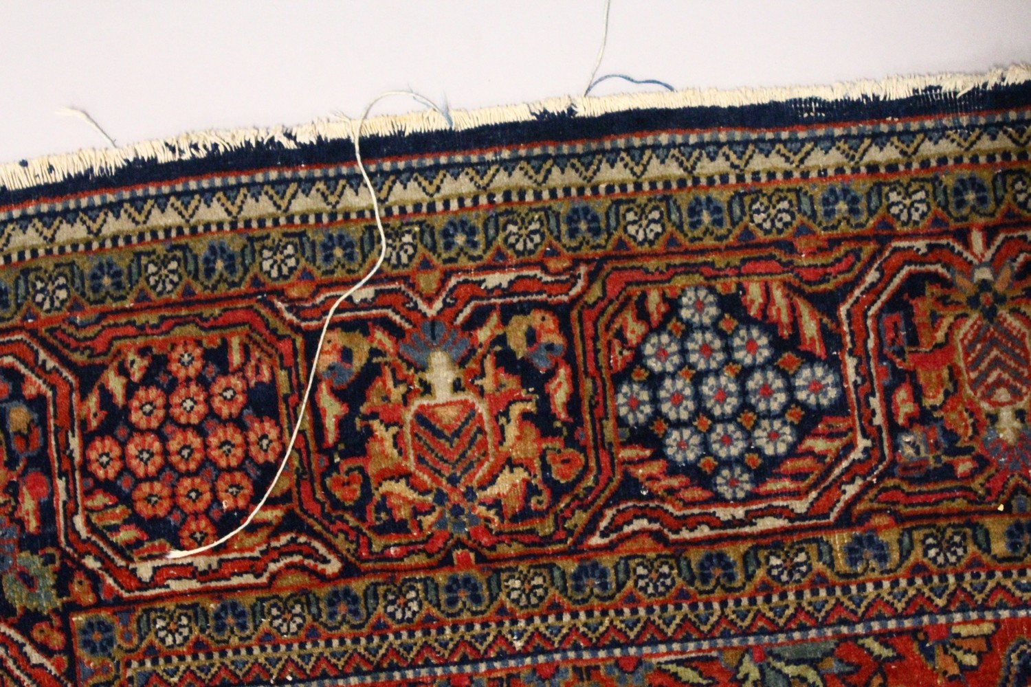 A KASHAN RUG, 20th Century dark blue ground with allover stylized tree and flower decoration. 6ft - Image 5 of 8