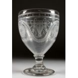 A VERY GOOD GOBLET, the bowl etched with rams and motifs. 8ins high.