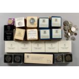 A QUANTITY OF ROYAL COMMEMORATIVE AND OTHER COINS, contained in a black Japanned tin trunk.