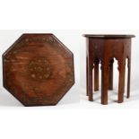 A SMALL EASTERN BRASS INLAID OCTAGONAL HARDWOOD STAND. 12ins wide x 16ins high.