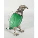 A VERY GOOD EAGLE CLARET JUG, with glass body, plated head with glass eyes and plated feet. 10ins