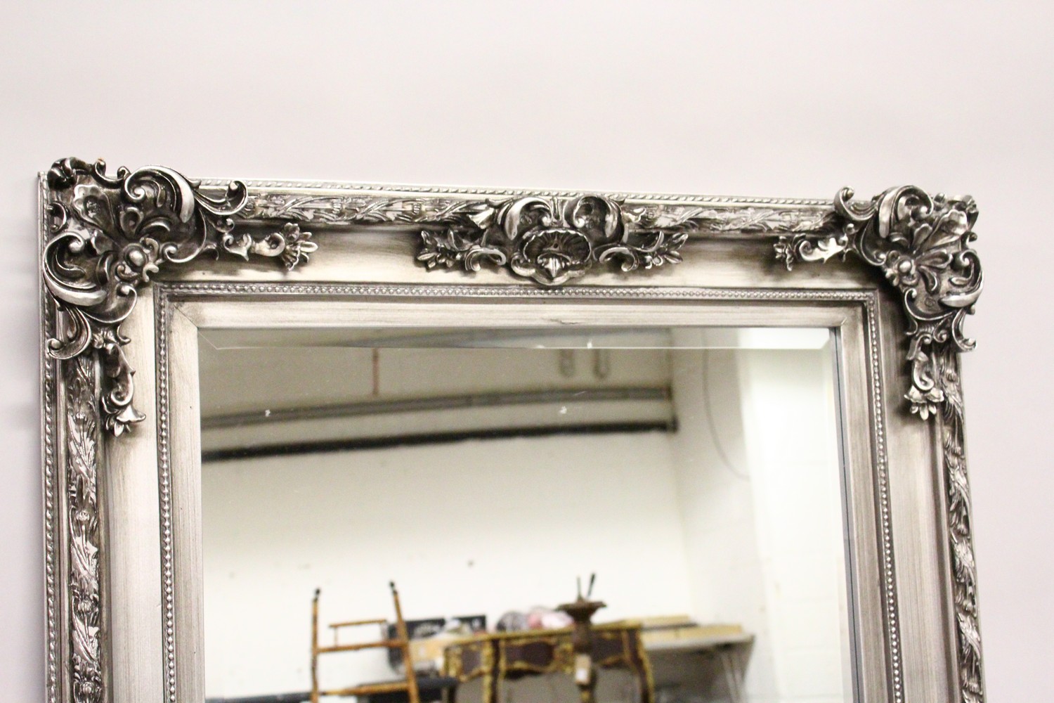 A LARGE WALL MIRROR, with moulded silver coloured frame. 5ft 7ins x 2ft 9ins. - Image 2 of 3