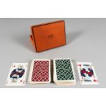 TWO PACKS OF HERMES PLAYING CARDS, in an original Hermes box.