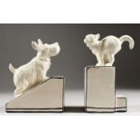 A PAIR OF CREAMWARE PORCELAIN BOOKENDS, DOG AND CAT. 6ins.