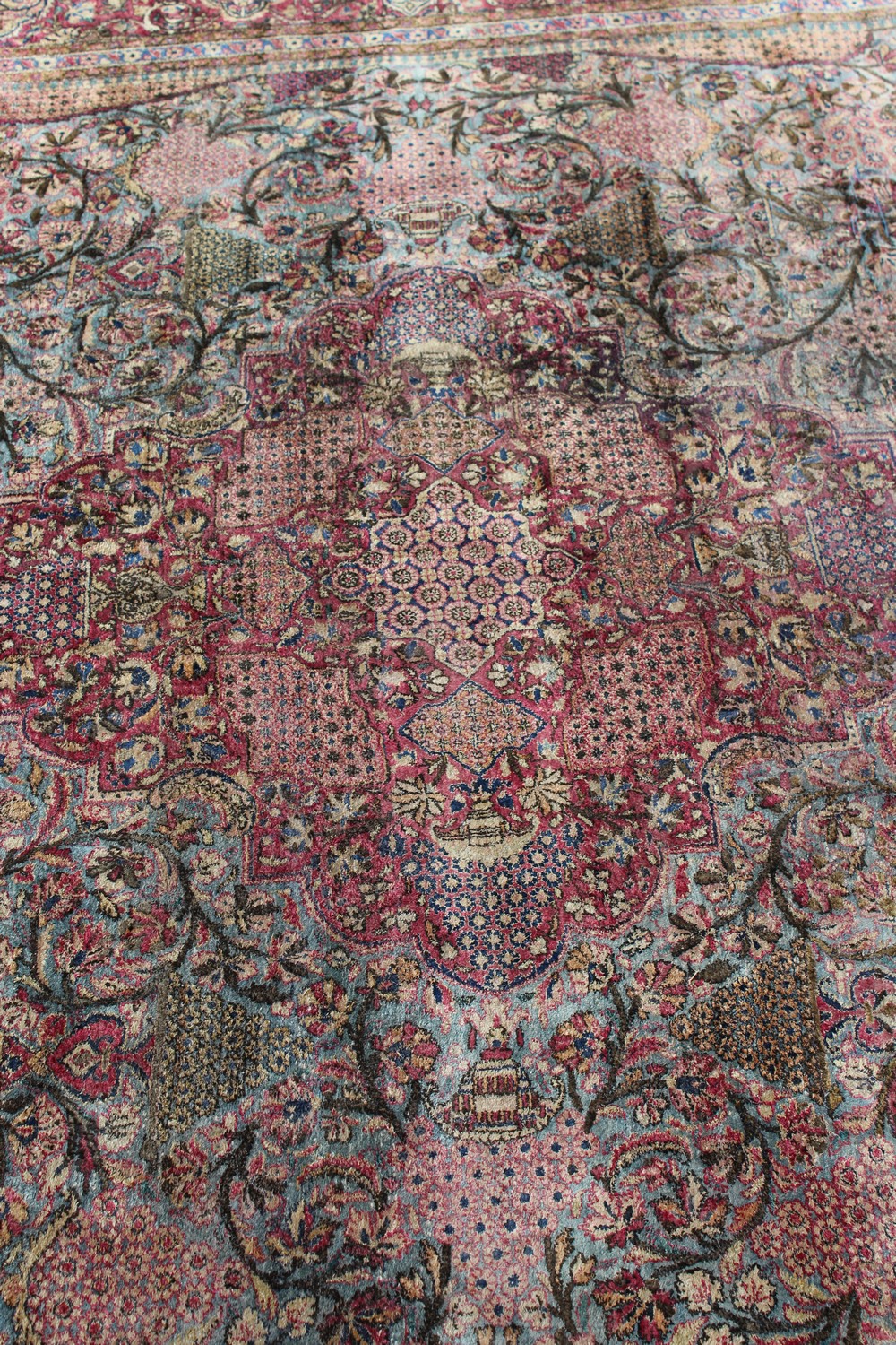 A 19TH/20TH CENTURY PERSIAN TEHRAN SILK CARPET, red ground with numerous vases of flowers, panels of - Image 10 of 15