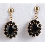 A PAIR OF 9CT GOLD GARNET SET DROP EARRINGS.