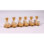 A VERY GOOD SET OF SIX SILVER AND SILVER GILT "PIG" CANDLESTICKS, as a pig with numerous holes, a