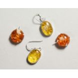 TWO PAIRS OF SILVER AND AMBER EARRINGS.