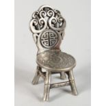 A CHINESE WHITE METAL "COIN" CHAIR. 3.25ins high.