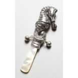 A SILVER SEAHORSE BABIES RATTLE, with mother-of-pearl handle. 3.5ins long.