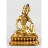 A CHINESE GILT BRONZE FIGURE OF A SEATED DEITY. 8ins high.