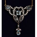 A 9CT GOLD AND SILVER, BLUE TOPAZ AND SEED PEARL PENDANT AND CHAIN.