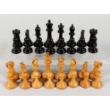 A GOOD SET OF STAUNTON CHESS MEN, plain wood and black , two castles with Staunton motif. King 3.