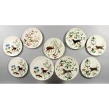 A DOULTON DESSERT SERVICE, painted with dogs, comprising two tazzas, seven plates.