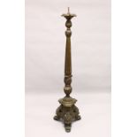A LARGE, CONTINENTAL CARVED AND PAINTED CHURCH STYLE CANDLE OR LAMP BASE. 5ft 2ins high.