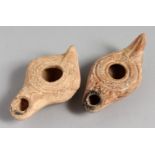 TWO SMALL TERRACOTTA OIL LAMPS.