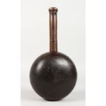 A VERY HEAVY EARLY LIGNUM BULBOUS MALLET, with ash handle. 5.5ins diameter.