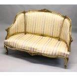 A 19TH CENTURY FRENCH GILTWOOD CANAPE, with later striped satin upholstery. 4ft 6ins wide.