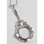 A SILVER OPAL SET SPY GLASS on a chain.