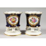 A SMALL PAIR OF MEISSEN PORCELAIN VASES, rich blue ground with vignettes of flowers, the bases