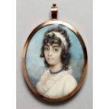 A GEORGIAN OVAL PORTRAIT MINIATURE OF A YOUNG LADY, white dress and blue necklace, the reverse