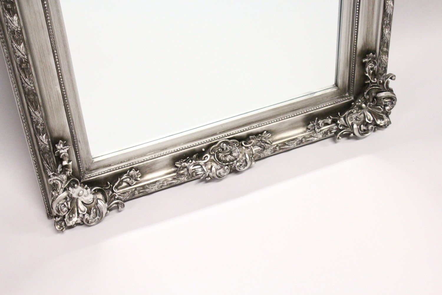 A LARGE WALL MIRROR, with moulded silver coloured frame. 5ft 7ins x 2ft 9ins. - Image 3 of 3