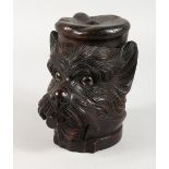 A LARGE BLACK FOREST CARVED WOOD DOG TOBACCO BARREL, smoking a cigarette. 7ins high.