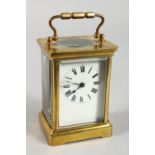 A 19TH CENTURY FRENCH BRASS CARRIAGE CLOCK TIMEPIECE. 4.5ins high.