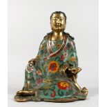 A CHINESE CLOISONNE SEATED FIGURE. 10ins high.