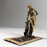 A VIENNA STYLE COLD PAINTED BRONZE OF A STANDING FEMALE AND TIGER ON A PERSIAN RUG. 6.5ins long.