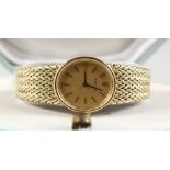 A VERY GOOD 14CT YELLOW GOLD LADIES ROLEX WRISTWATCH, with papers, in a blue box.