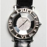 A MOUSSAIEFF ROMAN 18CT WHITE GOLD AND DIAMOND WRISTWATCH, diamond numerals and face, with leather