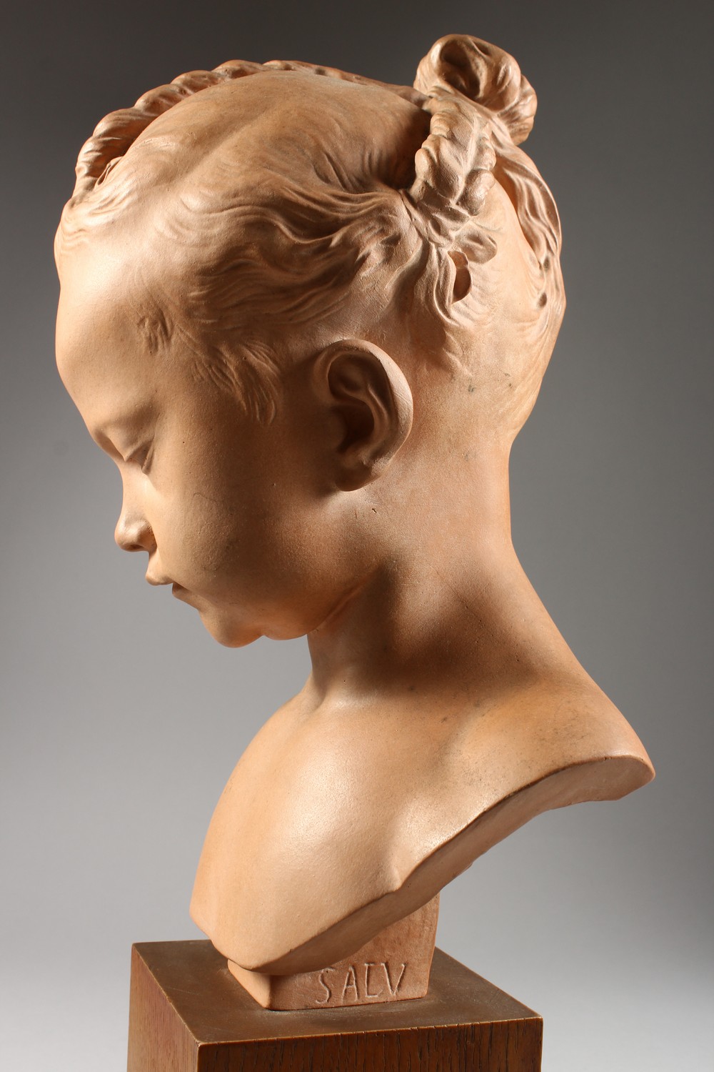 SALY A GOOD TERRACOTTA BUST OF A YOUNG GIRL, on a wooden plinth. Signed Saly, Louvre. 14ins high. - Image 3 of 7