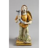 AN 18TH/19TH CENTURY ITALIAN MAIOLICA CANDLESTICK, modelled as a kneeling angel holding a cornucopia