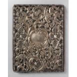 A REPOUSSE AND PIERCED SILVER MOUNTED PHOTO ALBUM. London 1910.