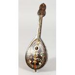 A MOTHER-OF-PEARL INLAID MUSICAL BOX, shaped as a mandolin. 9.5ins long.