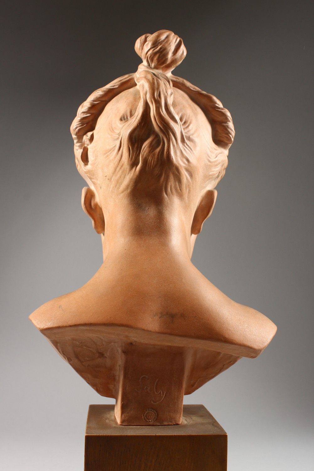 SALY A GOOD TERRACOTTA BUST OF A YOUNG GIRL, on a wooden plinth. Signed Saly, Louvre. 14ins high. - Image 4 of 7