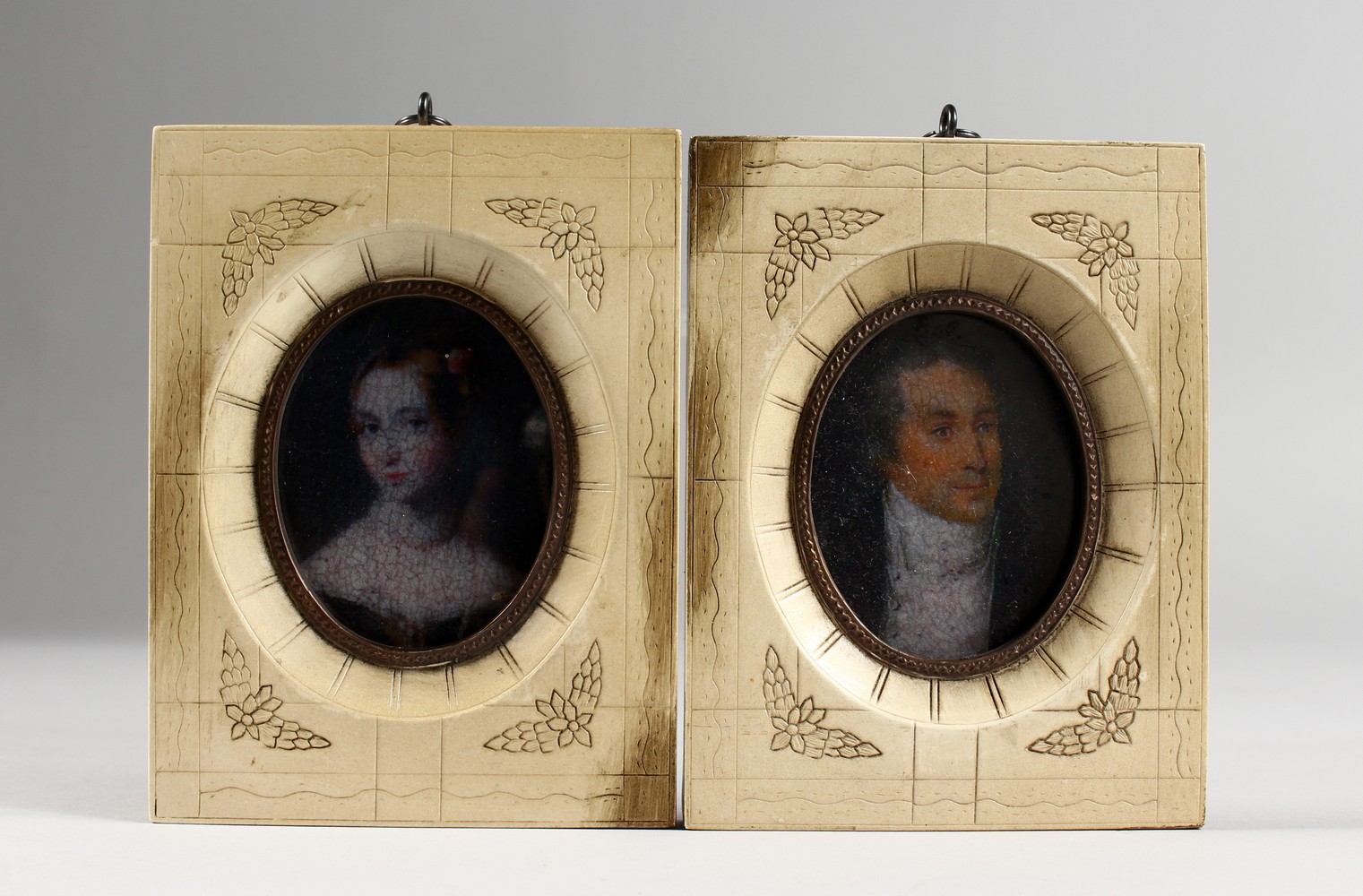 A PAIR OF MINIATURE PORTRAIT BUSTS. 5.25ins x 4ins.