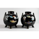 A PAIR OF ARTS & CRAFTS GLOBULAR SHAPED TERRACOTTA VASES, black glazed, painted with fish. 8ins