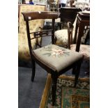 A set of four William IV mahogany dining chairs