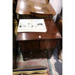 A 19th century mahogany commode with two small doors above two drawers on bracket feet