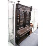 Continental style gothic revival stained pine cabinet