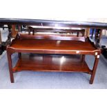 A pair of mahogany two tier rectangular tray top coffee tables