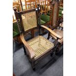 A walnut framed armchair with canework back and seat