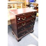 George III style mahogany four drawer chest with brushing slide